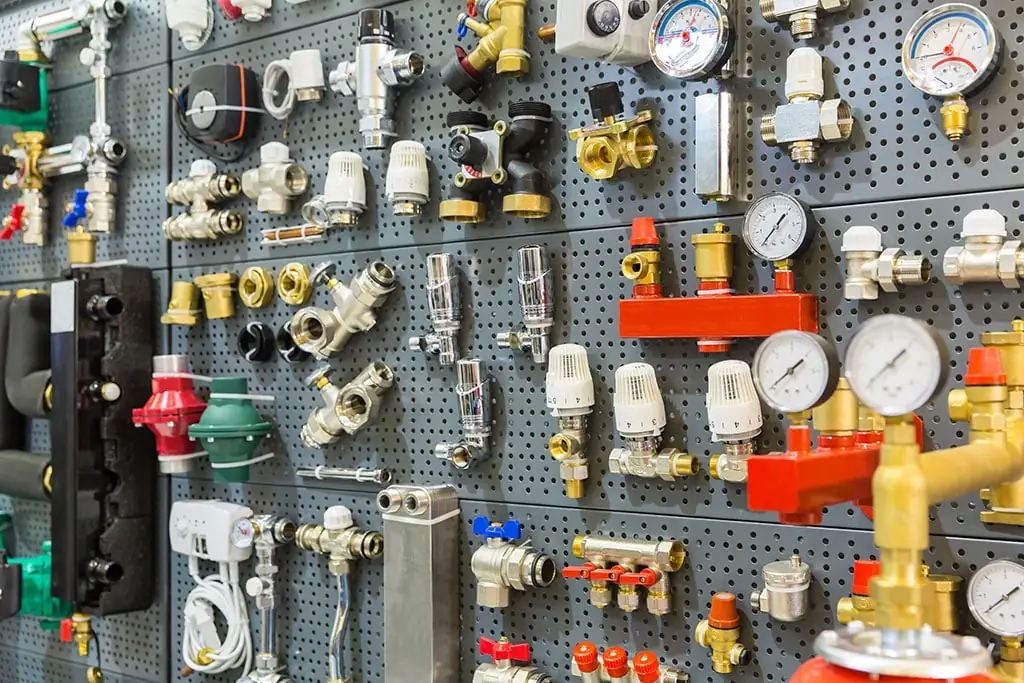 plumbing fittings on wall in a plumbing supply store