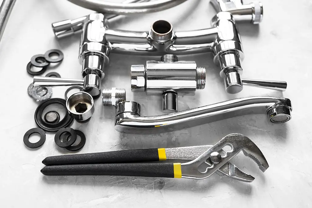 Polished chrome sinke pieces and plumbing plyers